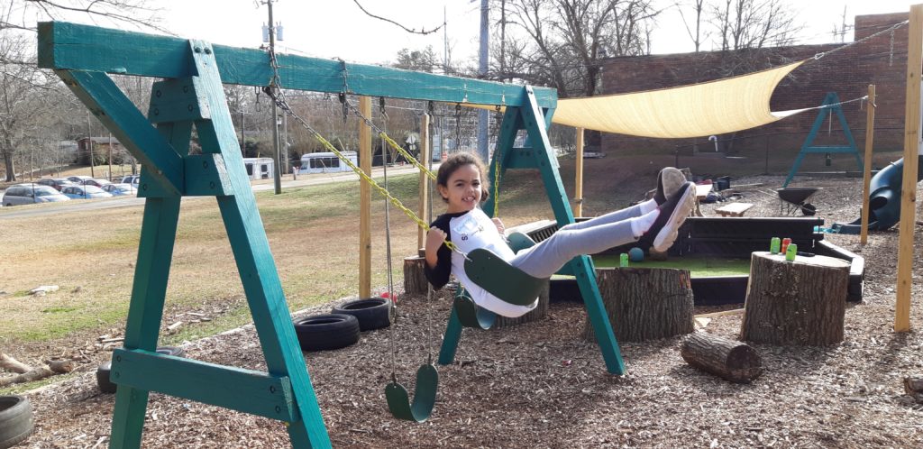 child on a swingset